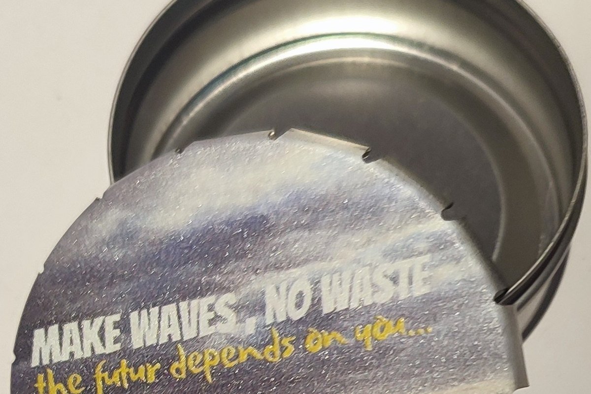 An Alia Vita pocket ashtray printed with the slogan Make waves, no waste